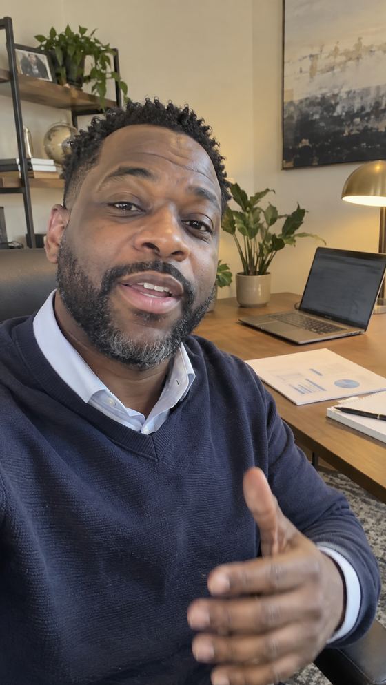 Raw, unedited phone video frame of a CFO advisor giving a cash flow tip from his home office desk.