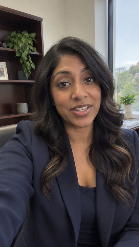 Raw, unedited phone video frame of an attorney speaking from her office.